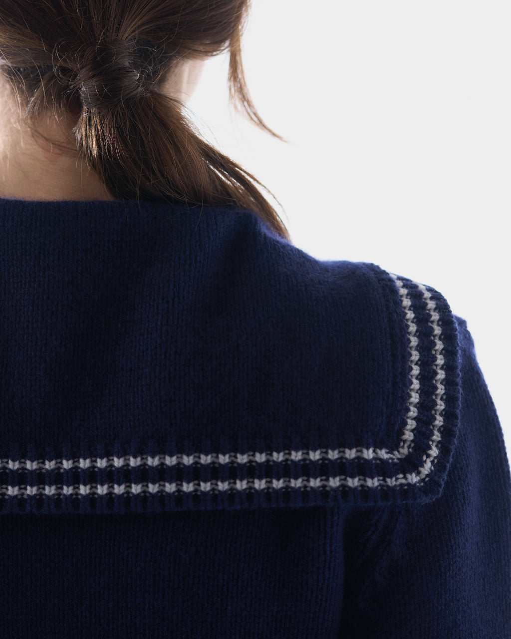 Sailor-collar cardigan in British Blue lambswool, worn, back view, alternate angle
